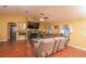 Cozy living room with fireplace, vaulted ceiling, and comfortable leather seating at 5572 Myakka Ave, Intercession City, FL 33848