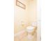 Close-up of a clean, well-maintained toilet in a neutral-toned bathroom at 5572 Myakka Ave, Intercession City, FL 33848