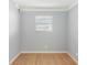 Bedroom with hardwood floors and single window at 5919 Mcenroe Ct, Leesburg, FL 34748