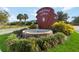 Welcoming entrance to Highland Lakes featuring lush landscaping and a decorative fountain at 5919 Mcenroe Ct, Leesburg, FL 34748