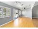 Bright dining area with shuttered windows, chandelier lighting, and beautiful flooring at 5919 Mcenroe Ct, Leesburg, FL 34748