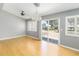 Dining room with a chandelier, sliding glass doors and shuttered windows bringing in ample sunlight at 5919 Mcenroe Ct, Leesburg, FL 34748