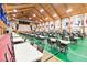 Large event space with a stage, tables, chairs, and flags for community gatherings and celebrations at 5919 Mcenroe Ct, Leesburg, FL 34748