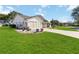 Attractive ranch-style home with a two-car garage and well-maintained lawn at 5919 Mcenroe Ct, Leesburg, FL 34748