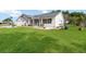 Lovely single-story house featuring a screened-in porch and mature landscaping at 5919 Mcenroe Ct, Leesburg, FL 34748