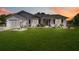 Charming single-story home with a well-manicured lawn and inviting front porch at 5919 Mcenroe Ct, Leesburg, FL 34748