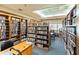 Well-stocked library with rows of books, a reading nook, and a comfortable atmosphere at 5919 Mcenroe Ct, Leesburg, FL 34748