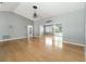 Bright and spacious living room showcasing wood floors and a view of the backyard at 5919 Mcenroe Ct, Leesburg, FL 34748