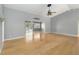 Spacious living room featuring an open floor plan and beautiful hardwood floors at 5919 Mcenroe Ct, Leesburg, FL 34748