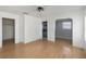 Living room featuring wood floors and archway at 5919 Mcenroe Ct, Leesburg, FL 34748