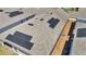 Aerial view of a roof with solar panels, gutters, and vents on a single Gathering home in a residential neighborhood at 6494 Rover Way, St Cloud, FL 34771