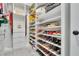 Walk-in closet with custom shelving and drawers for organized storage at 6494 Rover Way, St Cloud, FL 34771