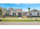 Inviting single-story home with manicured lawn, quaint entryway, and neat exterior at 6494 Rover Way, St Cloud, FL 34771