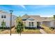 A charming single-story home showcases a well-kept lawn and classic architectural design at 6494 Rover Way, St Cloud, FL 34771