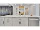 Kitchen island featuring quartz countertops, sleek cabinetry, and modern design elements at 6494 Rover Way, St Cloud, FL 34771