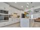Modern kitchen with white cabinets, stainless steel appliances, and a stylish backsplash at 6494 Rover Way, St Cloud, FL 34771