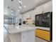 Bright kitchen showcasing a large island with quartz countertops and stainless steel appliances at 6494 Rover Way, St Cloud, FL 34771