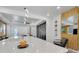 Open-concept kitchen with quartz countertops, modern lighting, and views into the living room at 6494 Rover Way, St Cloud, FL 34771