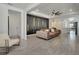 Spacious living room with statement wall, plush seating, and contemporary lighting at 6494 Rover Way, St Cloud, FL 34771