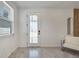 Bright, modern living room with white walls, stylish decor, and natural light streaming through the window at 6494 Rover Way, St Cloud, FL 34771