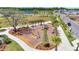 Community playground featuring a swing set, slide, picnic area with pergola, and green lawns at 6494 Rover Way, St Cloud, FL 34771
