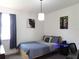 Bright bedroom with contemporary decor and comfortable furnishings at 6617 Harper Way, Harmony, FL 34773