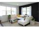 Cozy living room with natural light and modern furniture at 6617 Harper Way, Harmony, FL 34773