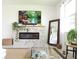 A comfortable living room features a stone fireplace and an oversized mirror at 6617 Harper Way, Harmony, FL 34773