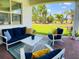 Outdoor patio area with furniture and scenic backyard views at 6617 Harper Way, Harmony, FL 34773