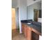 Bathroom vanity with granite countertops, updated cabinetry, and a glass enclosed shower at 6806 Trellis Vine Loop, Windermere, FL 34786