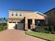 Charming two-story home featuring a two-car garage and well-maintained landscaping at 6806 Trellis Vine Loop, Windermere, FL 34786