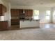 Bright, open kitchen with granite countertops, stainless steel appliances, and breakfast bar at 6806 Trellis Vine Loop, Windermere, FL 34786
