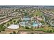 A bird's-eye view of a community swimming pool and recreation area surrounded by homes at 721 Drop Shot Dr, Davenport, FL 33896
