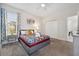Comfortable bedroom featuring carpet, a decorative bed, and neutral decor at 721 Drop Shot Dr, Davenport, FL 33896