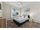 Bright bedroom with a comfortable bed, ceiling fan, and scenic view from the window at 721 Drop Shot Dr, Davenport, FL 33896