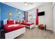 Fun bedroom with colorful Lego decor, twin beds, and ample space for play at 721 Drop Shot Dr, Davenport, FL 33896