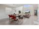 Open-concept living and dining area with high ceilings, abundant natural light, and stylish decor at 721 Drop Shot Dr, Davenport, FL 33896