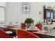 Elegant dining table setting with decorative plants, glassware, and modern tableware on a wood surface at 721 Drop Shot Dr, Davenport, FL 33896