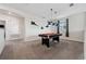Spacious game room featuring a pool table, contemporary lighting, and a comfortable atmosphere at 721 Drop Shot Dr, Davenport, FL 33896