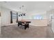 Upstairs game room featuring a pool table and window views at 721 Drop Shot Dr, Davenport, FL 33896