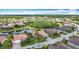 Beautiful lakefront community featuring gorgeous homes, palm trees, and well-manicured lawns from a stunning aerial view at 772 San Raphael St, Kissimmee, FL 34759