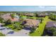 Aerial view showing the home's location on a waterfront lot, featuring lush landscaping and serene surroundings at 772 San Raphael St, Kissimmee, FL 34759