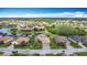 Beautiful lakefront community featuring gorgeous homes, palm trees, and well-manicured lawns from a stunning aerial view at 772 San Raphael St, Kissimmee, FL 34759