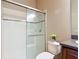 Bathroom featuring a glass shower, toilet, and granite vanity at 772 San Raphael St, Kissimmee, FL 34759
