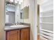 Bathroom featuring a vanity, a mirror, and built-in storage shelving at 772 San Raphael St, Kissimmee, FL 34759