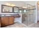Modern bathroom featuring glass shower and a granite-topped vanity at 772 San Raphael St, Kissimmee, FL 34759