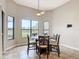 Bright breakfast nook with tiled floor, large windows offering a view, and a ceiling fan at 772 San Raphael St, Kissimmee, FL 34759