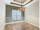 Dining room featuring decorative molding, unique lighting, and tiled flooring at 772 San Raphael St, Kissimmee, FL 34759