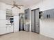 Garage with storage cabinets and ceiling fan at 772 San Raphael St, Kissimmee, FL 34759