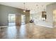 Bright, open-concept living space with tiled flooring, ceiling fans, and a kitchen island at 772 San Raphael St, Kissimmee, FL 34759
